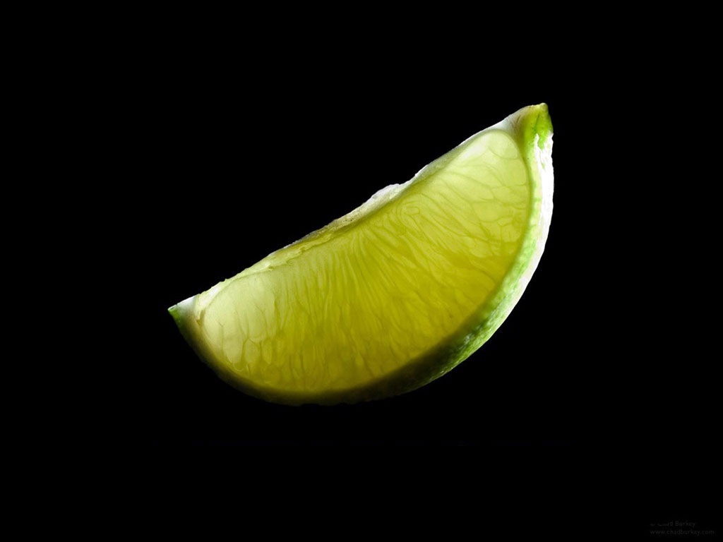Lime slice close-up on black background